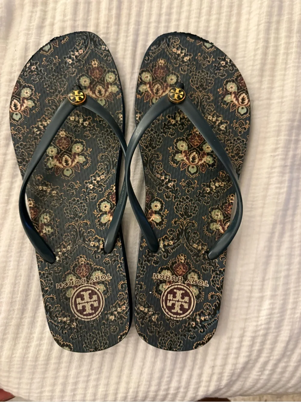 Tory Burch Navy Floral Logo Flip Flops with Gold Emblem